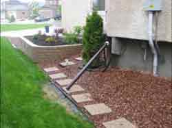 Improperly placed downspout photo 1