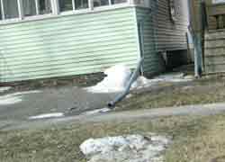 Improperly placed downspout photo 3