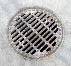 Open grate manhole cover photo