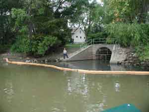 Boom placed in the Red River to catch floating debris at the Jefferson outfall