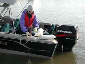 Collecting river water samples for testing